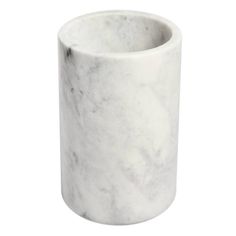 a white marble vase sitting on top of a table