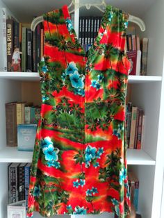 1960's Flowered Hawaiian Dress Fashioned by Hukilau Fashions of Honolulu Mulicolor Print Combed Cotton Fabric 6 Inch Side Splits SIZE: Small MEASUREMENTS (in inches): Shoulder to Shoulder (back): 15 Bust: 32 Side Length (armpit to hem): 25 Arm Length (armpit to cuff): Sleeveless Neck Opening: 32 inch/Front and Back VNeck Neck to Hem Length (back): 32 INTERNATIONAL CUSTOMER?? Please email for Shipping Info Vintage Multicolor V-neck Dress, Vintage Beach Dress With Tropical Print, Vintage Dress With Tropical Print For The Beach, Vintage Tropical Print Dress For Vacation, Vintage Tropical Print Dresses For Vacation, Vintage Tropical Print Beach Dress, Fitted Multicolor Hawaiian Dress, Vintage V-neck Dress With Retro Print, Vintage Red Dress For Vacation