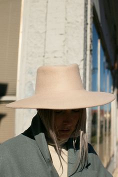 An effortless low pinch hat with a wide brim. Fabric is 100% Angora. Blocked by hand in New York. Inner circumference 22.25", crown height 3.5", brim length 4.25" Fall Flat Brim Top Hat, Fitted Flat Crown Hats, Elegant Brimmed Hat, Spring Flat Brim Felt Hat, Elegant Hat With Curved Brim And Rigid Fit, Elegant Rigid Hat With Curved Brim, Fur Felt Hat With Curved Brim For Spring, Spring Fur Felt Hat With Curved Brim, Elegant Flat Brim Rigid Hat