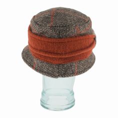 With an autumnal palette to greet the season, the Belfry Felicia is a bucket made to be your new fall go-to. From the cozy brown windowpane pattern to the bi-color band of pumpkin and tan with buttoned accent, it easily dresses up any casual and cozy look for the day! FEATURESStyle: BucketMaterial: 80% Wool, 20% PolyesterDimension: 4" Crown, 2" BrimSizing: OSFM, 58CM Autumnal Palette, Color Bands, Burnt Orange, Crown, Wool, Band, Orange, Pattern, Dresses