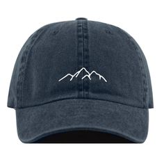 a blue hat with mountains embroidered on it