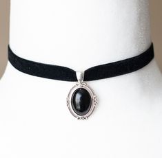 This Victorian inspired choker is made from black velvet ribbon and antique silver filigree pendant housing a black agate stone. - The choker measures 12 inches/30.5cm in length and 0.4 inches/10mm wide - The pendant is approximately 1 inch long and 0.75 inch wide - The choker closes with a lobster claw clasp at the back - One size fits most (for a neck of about 12.5 inches). there is a 2 inch extension chain at the back to accommodate larger neck sizes SHIPPING: Default shipping is by regular m Formal Black Ribbon Choker Jewelry, Formal Black Jewelry With Black Ribbon, Victorian Gothic Jewelry, Statement Necklace Black, Black Velvet Ribbon, Black Agate Stone, Gothic Chokers, Black Velvet Choker, Black Choker Necklace