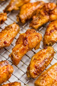 chicken wings are cooking on a wire rack