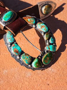 One of my favorite things to design, sterling silver and American turquoise "Ranger" buckles are inspired, artful creations. They look amazing with our vintage latigo belts or Wild West turquoise concho belts. This set is unique that it has a top, keeper, and a beautiful combination including natural Piolet Mountain and Royston turquoise. Our On the Range finish 3.5 to 4 inch size range. Please contact me for availability and pricing, as buckle sizes and prices do vary. I do my best to keep thes Vintage Turquoise Belt With Concho, Turquoise Bohemian Belt With Concho, Southwestern Turquoise Concho Belt Buckles, Southwestern Turquoise Jewelry With Antique Buckle, Turquoise Bohemian Belt Buckle With Antique Detail, Southwestern Antique Belt Buckles For Ranch, Concho Belts, Concho Belt, American Turquoise