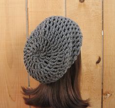 This is made to order. This beanie is super slouchy. It is stretchy and will fit most teens or adults, men or women. It will fit anywhere on your head and has a large enough slouch to tuck lots of hair. It is very simple but classy. If you would like a different color please specify color. Hand wash is recommended. Please choose your size from the drop down menu. One Size Gray Crochet Hat For Fall, Gray Crochet Hat One Size Fits Most, Slouchy Gray Hat For Fall, Hand Knitted Gray Crochet Hat One Size, Gray Hand Knitted Crochet Hat One Size, Gray Crochet Hat Made Of Yarn, Hand Knitted Gray Crochet Hat, Gray Crochet Yarn Hat, Handmade Gray Crochet Hat One Size