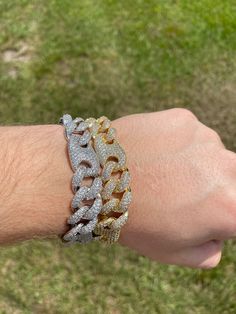 FAST SHIPPING!*TRUSTED SELLER**2300+ TRANSACTIONS* -Will be shipped through USPS with First Class Mail that includes tracking so you'll get it quick! -Don't confuse this with those cheap low quality cuban links that have glued in stones. -Premium 14k white gold OR 14k yellow gold plated diamond figaro cuban link Bracelet! -Plating is PVD which is the highest quality. -Stones are high quality VVS simulated lab diamonds(CZ)! Hand prong set and not glued in like the cheap ones! -Very nice box clasp Luxury Cuban Link Bracelet With Bling, Diamond White Iced Out Cuban Link Bracelets, Luxury Bling Cuban Link Bracelets, Iced Out Diamond White Cuban Link Bracelets, Dazzling Iced Out Cuban Link Jewelry, White Diamond Cuban Link Bracelets, Gold Cuban Link Tennis Bracelet With Diamond Accents, Gold Diamond Cut Cuban Link Bracelet, Gold Tennis Bracelet With Diamond Accents And Cuban Link