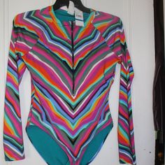 New With Tags Trina Turk Louvre Swim Long Sleeve Paddle Board Suit Pretty Colors (Multi Colors) Striped Colors Half Zipper Front Long Sleeves Thumbholes Fitted Sz Xl Panty Lining New With Tags No Defects Non Smoking Home. Msrp $172 Multicolor Long Sleeve Swimwear For Spring, Fitted Striped Swimwear For Spring, Trendy Fitted Long Sleeve Swimwear, Multicolor Stretch Beachwear Tops, Trendy Long Sleeve Multicolor Swimwear, Trendy Multicolor Long Sleeve Swimwear, Colorful Fitted Vibrant Top, Trendy Long Sleeve Swimwear For Spring, Spring Green Long Sleeve Swimwear