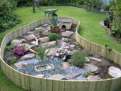 a garden area with rocks, plants and gravel in the center is shown from above