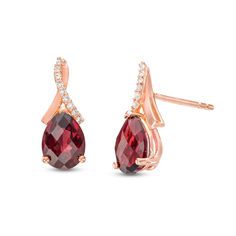 Wear your favorite birthstone in elegant style with these beautiful pear-shaped red garnet and white lab-created sapphire drop earrings. Fashioned in sterling silver with 14K rose gold plate Each drop showcases a faceted 8.0 x 6.0mm pear-shaped regal red garnet. White lab-created sapphires partially line the loop-top twist post, adding a touch of shimmer to the look. Garnet is the traditional birthstone for January and symbolizes friendship, loyalty and devotion. These earrings secure comfortabl Sapphire Drop Earrings, White Sapphire Earrings, Rose Gold Plate, White Lab, Red Garnet, White Sapphire, Pear Shaped, Rose Gold Plates, Elegant Style