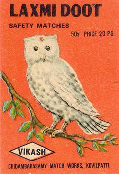 the label for laxmi dot safety matches shows an owl perched on a branch