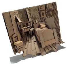 an image of a cardboard cutout of a bedroom with bed and chair in it