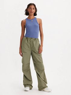 The bigger, the better. We cut these Parachute Pants with a wide leg for a leg-lengthening effect and a mid rise that hits right at your waist. Y2K is here to stay;and these pants prove it. Of-the-moment parachute pants Cut with a wide leg Features a mid rise Crafted with non-stretch poplin fabric Parachute Pants Outfit, Green Pants Outfit, Jeans Bootcut, Skate Style, Levis Women, Green Pants, Poplin Fabric, Pants Outfit, Parachute Pants