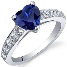 a heart shaped blue sapphire and diamond ring