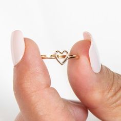 14k Heart Ring | Solid Gold Ring | Stacking Ring | Gold Dainty Ring | Gold Heart Ring | Gold Pinky Ring | Minimalist Ring | Valentines Gift ➔ Made to Order ➔ Gold Karat: 14K gold ➔ Band Width: 1.5mm (Please note that due to variations in computer/phone screens and the natural stones we use, the color of stones may vary) This ring is made to order, please allow 3-10 business days before shipping. Want it sooner? Ask us and we will let you know if it's possible! ♦︎ Check out more about our shop at: https://etsy.me/3qqqait ♦︎ Any Questions or Comments? Contact us Below: https://etsy.me/3twDq7a Go direct to our categories: Diamond Rings: https://etsy.me/4adgGMQ Diamond Earrings: https://etsy.me/41ldoTQ Diamond Necklaces: https://etsy.me/3TjKqBD Diamond Wedding Bands: https://etsy.me/3uSyCw5 Ru Heart Ring Gold, Gold Dainty Ring, Gold Ring Stacking, Gold Pinky Ring, Gold Heart Ring, Dainty Gold Rings, Diamond Necklaces, Solid Gold Ring, Phone Screens