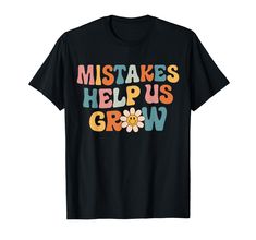 a black t - shirt with the words,'makes help us grow'on it