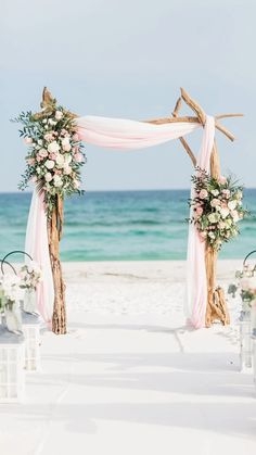 an outdoor ceremony set up on the beach