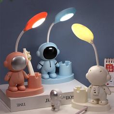 an image of two lamps that are on the table with other items in front of them