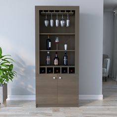 a tall wooden cabinet filled with bottles and glasses