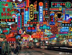 a city street filled with lots of neon signs