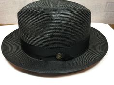 Dobbs Fifth Ave New York Rosebud Mens Straw Gangster Hat  Size 7 56cm, 7 1/4 58cm, 7 3/8 59cm, 7 1/2 60cm, 7 5/8 61cm, 7 3/4 62cm, 7 1/8 57cm Color Black  Brim 2 1/8'' Crown 5'' Made in U.S.A. Casual Fitted Solid Hat Bands, Casual Solid Fitted Hat Bands, Fitted Flat Bill Panama Hat For Spring, Fitted Casual Fedora With Short Brim, Casual Fitted Fedora With Short Brim, Fitted Flat Bill Panama Hat For Summer, Casual Fitted Short Brim Fedora, Fitted Flat Bill Hats For Summer, Fitted Flat Bill Hat For Summer