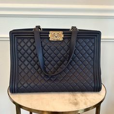 Chanel Navy Blue Boy Bag Tote Chanel Navy Blue Boy Bag. Has Tiny Scuffs In Side Bottom.(See Pics) In Excellent Condition And Looks New! Comes With Authentication Card, Box, And Dustbag! 14"L X 6.5"W X 10"H Navy Chanel, Chanel Tote, Chanel Boy, Large Bags, Womens Tote Bags, Chanel Bag, Navy Blue, Dust Bag, Chanel