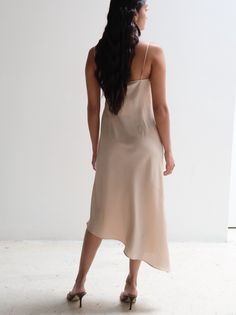 This Vintage Pianoforte di Max Mara Silk Slip Dress is a classic, elegant piece perfect for any special occasion. Made with silk, it is both comfortable and chic. The aysmmetrical design adds a touch of sophistication, making you stand out in any setting. PRODUCT DETAILS + FIT: Made in Italy Bust: 36" Waist: 34" Hips: 40" Asymmetrical Silk Slip Dress For Spring, Elegant Fitted Slip Dress With Asymmetrical Hem, Summer Silk Slip Dress With Asymmetrical Hem, Elegant Slip Dress With Asymmetrical Hem For Formal Occasions, Classic Silk Maxi Dress With Bias Cut, Elegant Asymmetrical Hem Party Slip Dress, Asymmetrical Beige Cocktail Dress, Elegant Asymmetrical A-line Evening Dress, Classic Silk Bias-cut Maxi Dress