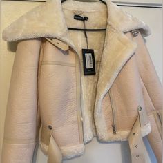 Pretty Little Thing Women's Jacket. Us Size Small. Faux Fur & Moto Style Jacket With Belt. Inside Lined With Fur. Cute Zippers On Sleeves. Cream/Beige Color. Never Worn New With Tags. Spring Biker Jacket With Faux Fur Trim, Winter White Leather Jacket With Long Sleeves For Fall, Winter White Leather Jacket For Fall, Chic Cream Biker Jacket For Winter, Trendy Spring Biker Jacket For Cold Weather, Trendy Cream Cropped Winter Jacket, Cream Beige Color, Belted Jacket, Moto Style