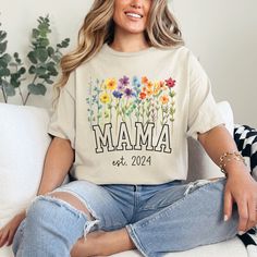 WILDFLOWERS MAMA SHIRT This flower t-shirt for Mom is a perfect gift to celebrate a new mother on such a special day. The wildflower design with a touch of color makes it friendly when combining your clothes. ❤️Perfect as a gift ❤️Print unforgettable moments. PRODUCTION TIME: 👉 2 -4 days (2 day average) SHIPPING TIME: 👉 5 - 7 days (6 day average) 👉 Printed and shipped from the USA. ABOUT THIS PRODUCT: 👉100% ring-spun US cotton. 👉100% SAFE PACKAGING. 👉The pre-shrunk fabric ensures a consistently great fit.  PRINTING METHOD: 👉 Each mug is carefully crafted using the sublimation technique for a shiny, long-lasting finish. HOW TO PERSONALIZE THIS MUG 1. Choose the color of the tshirt (black and naby t-shirts have white lettering). 2. Choose the size of the tshirt NOTE: ✨If you have any Mother's Day Floral Print Short Sleeve Top, Floral Print Short Sleeve Top For Mother's Day, Floral Print Short Sleeve Top, Mother's Day Floral Print Relaxed Fit T-shirt, Spring Gift Shirt With Relaxed Fit, Spring Shirt With Letter Print For Gifts, Spring Letter Print Shirt For Gift, Spring Letter Print Shirt As Gift, Floral Print Relaxed Fit Tops As Gift