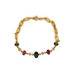 This dazzling Art Nouveau Tourmaline & Diamond Bracelet features multi-colored gemstones in 18k yellow gold. A vintage bracelet with a timeless look. Four (4) tourmalines decorate the ornate chain bracelet, reflecting hues of rosy reds and greens. A collection of earthy gemstones with cosmic charm. Four (4) accent diamonds add a pop of sparkle, mounted in-between each tourmaline. Finished on a decorative yellow gold chain link bracelet measuring 7 inches long. A chic gift for you or your loved o Elegant Gold Tourmaline Bracelets, Gold Vintage Bracelet, Vintage Gold Bracelet, Fashion Drawings, Earthy Jewelry, Nouveau Jewelry, Colored Gemstones, Chinese Symbols, Dope Jewelry