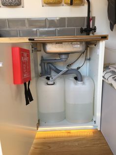 there are two gas tanks in the cabinet