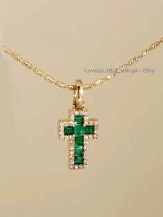 18k Solid Gold Natural Emerald Cross Charm 🌟 Product Description:  Materials:  18k Solid Gold, Not Gold Vermeil/Gold Filled  Natural Emerald Stones: 0.35 carat Natural Diamonds: 0.14 carat Cross Charm Dimensions: 16mm x 7mm approximately Unlike gold vermeil or gold filled, 18k Solid gold pieces are known to be durable and long lasting when properly cared for. 🎁 Discover more unique and fine jewelry pieces from our store:  ✈️ FREE Shipping: Domestic and International Important Notes: ◽️ We use natural gemstones, please note that each stone is unique and colours may vary slightly from piece to piece, making your jewelry truely one of a kind. ◽️ These gorgeous pieces are handcrafted and made to order. The turn around time is 1-2 weeks after the order is placed.  ◽️ We do not accept returns Emerald Cross, Gold Piece, Emerald Stone, Cross Charms, Natural Emerald, Gold Vermeil, Favorite Jewelry, Jewelry Pieces, Charm Necklace