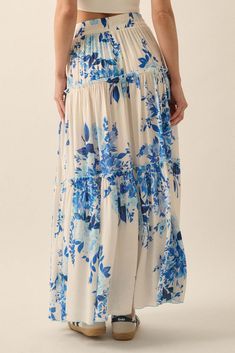 Floral-print maxi skirt. Drawstring elastic waist. Tiered ruffle design. Ruffle trim with lettuce-edge finish. Ankle length. Loose fit. 100% Rayon. Imported. Designed in LA. Model wears size S.