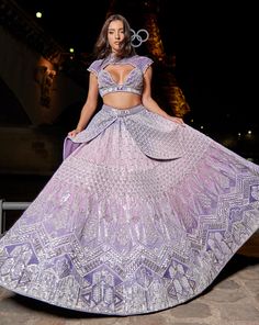 Purple Ombre Lehenga Set, a blend of elegance and artistry. Handcrafted with intricate hand embroidery, the linen satin lehenga radiates grace. Paired with a matching blouse and complemented by an ethereal organza dupattaFrom Jigar Nikita’s 11:11 In Paris collection DELIVERY TIMEPlease allow 8-12 weeks for your outfit to arrive. FABRIC DETAILSLehenga - Linen Silk, Blouse - Net & Linen Silk, Dupatta - Net Professional cleaning only. Designer Sets With Intricate Embroidery For Party, Traditional Hand Embellished Purple Sets, Festive Purple Hand Embellished Sets, Festive Hand Embellished Purple Sets, Festive Hand-embellished Purple Sets, Luxury Designer Sets With Resham Embroidery, Hand Embellished Purple Wedding Sets, Purple Bollywood Dress Hand Embellished, Hand Embellished Purple Lehenga For Wedding