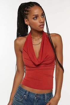 Sleek Silence + Noise top in a halter neckline style. Designed in a soft & stretchy knit featuring a plunging v-neckline with cowl draping and finished with an open back. Only at Urban Outfitters. Features Silence + Noise Coyote cowl neck top Cropped halter top Soft and stretchy knit Plunging v-neckline with halter strap Draping on the bust and v-hem bodice Open back Slim body-skimming fit Cropped length Easy pull-over style UO exclusive Content + Care 94% Polyester, 6% spandex Machine wash Impo Rust Top, Cropped Halter Top, Neck Halter Top, Graphic Tee Dress, Halter Strap, Cowl Neck Top, Halter Crop Top, Urban Outfitters Tops, Halter Neckline