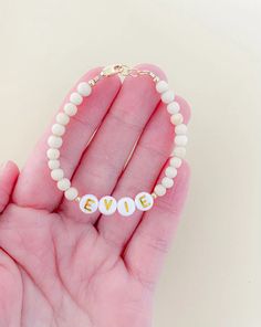 This beautiful personalized gold filled name bracelet is a perfect gift for anyone! Mamas, toddlers and children love these custom bracelets made to last. Order a matching "mama" or "first name" bracelet for you and your little one. Our Bracelets are Handmade in the USA and are made with high quality gold & white letter beads with 14K gold filled attachments. You will enter the custom name in the text box before adding to the cart. They are beautiful and add the perfect amount of dress up to eve Mommy Baby, Baby Bracelet, Personalized Bracelet, Text Box, Letter Beads, Fall Accessories, Name Bracelet, Personalized Bracelets, White Letters