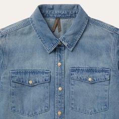 A looser take on a Stetson classic, this light denim snap-front shirt features oversized snap-front patch pockets at the chest, and is lightly distressed for a worn-in feel, including a raw-edge hem at the cuffs. Finished with single point front and back yokes and single-snap cuffs. 100% Cotton Single Point Back Yoke Single Snap Cuffs Imported Casual Faded Button-up Tops, Unstructured Washed Shirt In Medium Wash, Classic Washed Denim Top, Classic Washed Denim Top For Everyday, Unstructured Denim Shirt In Medium Wash, Washed Denim Collared Shirt, Medium Wash Chambray Shirt, Unstructured Medium Wash Denim Shirt, Unstructured Light Wash Denim Shirt