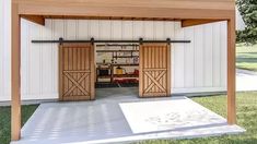 an outdoor garage with two doors open