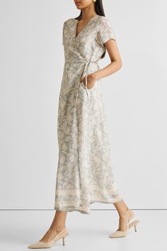 Unveil elegance with our 'Maxi Wrap Dress in Blue Florals,' featuring a relaxed fit and adorned with delicate blooms. This chic wrap dress, perfect for cool evenings or leisurely afternoons, offers both style and comfort. Embrace its versatile design, complemented by the convenience of pockets on both sides. Elevate your summer wardrobe with this trendy maxi dress, ideal for casual gatherings or a stylish day out. Wash in cold water or dry clean only Do not soak bleach or wring Line dry in shade Elegant Floral Print Wrap Maxi Dress, V-neck Floral Print Wrap Dress For Daywear, Summer Floral Print Wrap Dress For Daywear, Trendy Maxi Dresses, Vintage Bouquet, Blue Florals, Floral Wrap Dress, Wrap Dress Floral, Maxi Wrap Dress