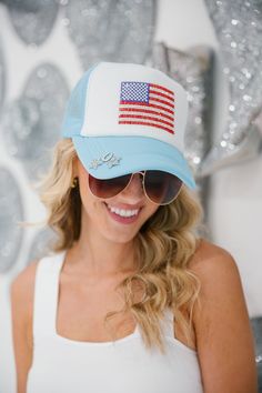 Show your national pride with the BORN FREE Trucker Hat. Featuring a custom 4th of July design with a unique rhinestone flag and silver star pins, you'll be sure to stand out from the crowd. Represent America in style! This is a a limited addition style to this collection and only a certain quantity are made. This hat is one-of-a-kind, created by our owner Stephanie. All orders are currently shipping within 14 business days. To receive item quicker, expedited shipping is available at checkout. Adjustable Blue Trucker Hat For 4th Of July, Patriotic Trucker Hat For Memorial Day, Patriotic Blue Trucker Hat For 4th Of July, Patriotic Blue Hat For 4th Of July, Blue Baseball Cap For 4th Of July, Patriotic Blue Hat For Memorial Day, American Flag Trucker Hat For Memorial Day, 4th Of July Design, July Design