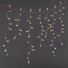 Create a gorgeous display in your home for the holidays or any other occasion with the 300-Count High Density Icicle Lights with White Wire from Wondershop™. These icicle lights are designed with 300 bulbs that connect end-to-end to look great along roof awnings, peaks, windows or any other space. The clear lights help create a glowing space with their constant lighting effect and light up with one setting. Wondershop™: Welcome to the Wondershop. Christmas Icicle Lights, Icicle Lights Outdoor, Cherry Blossom Candle, Led Icicle Lights, Letter Candles, Icicle Christmas Lights, Outdoor Light Bulbs, Globe String Lights, White Light Bulbs