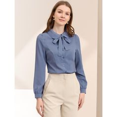 Whether you're in the office or out on the town, this cute blouse is perfect for any occasion. The soft fabric will keep you comfy all the time. Simple and classic shirts are never out of date and maintain an elegant appearance. The stylish Peter Pan collar and bow-tie neck design are different from those of classic shirts, adding a unique feminine. A classic blouse goes well with everything. It can be dressed up with dress pants or casual with skinny jeans or plaid skirts to show the preppy sty Light Blue Buttoned Blouse For Work, Light Blue Button Blouse For Work, Office Wear Blouse With Back Button, Office Wear Blouse With Back Button Closure, Blue Puff Sleeve Shirt For Work, Light Blue Long Sleeve Blouse With Buttons, Office Long Sleeve Blouse In Solid Color, Blue Workwear Blouse With Back Button Closure, Light Blue Button-up Blouse For Work