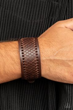 Shiny brown cording boldly crisscrosses across the front of a thick brown leather band, creating an edgy centerpiece around the wrist. Features a buckle closure. Sold as one individual bracelet. Brown Leather Braided Bracelet, Brown Braided Leather Bracelets, Adjustable Brown Leather Bracelet With Belt Detail, Brown Leather Bracelet With Wrist Strap, Adjustable Brown Leather Belt Bracelet, Rugged Brown Leather Bracelet, Brown Bracelet, Brown Jewelry, Trendy Fashion Jewelry