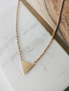 TO THE POINT TRIANGLE NECKLACE Triangle Necklace With Adjustable Chain For Gift, Elegant Gold Triangle Necklace, Minimalist Triangle Gold Jewelry, Minimalist Gold Triangle Jewelry, Elegant Triangle Necklace For Gifts, Elegant Triangle Everyday Jewelry, Trendy Triangle-shaped Gold Jewelry, Trendy Triangle Gold Jewelry, Trendy Triangular Gold Jewelry