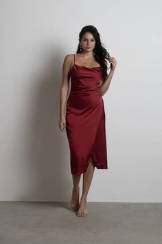 "The Maddy Cabernet Red Cowl Neck Satin Slip Midi Dress Is Perfect For Any Formal Occasion. This Satin Dress Features A Cowl Neck, Adjustable Shoulder Straps, And A Back Zipper Closure. Bonus: This Dress Features A Front Slit." Maroon Satin Dress, Red Cowl Neck Dress, Holiday Formal Dresses, Ginger Models, Holiday Dresses Women, Slip Midi Dress, Winter Formal Dresses, Cowl Neck Dress, Holiday Party Dresses