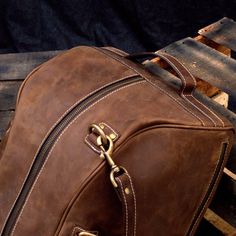 "DIMENSIONS: 10.5\"H x 19\"L x 10.5\"D x | 26.5 cm H x 48 cm L x 26.5 cm D CAPACITY : 34 L This Comfortable Leather Duffel Bag is the ultimate rebirth of antique style weekender bags. We designed it with high quality leather from cowhide. This luggage overnight travel bag is designed to keep all your essentials centralized for a weekend. This travel handbag lets you work on-the-go with its extra laptop pocket having special cushion protection to keep your MacBook/Laptop safe. We made sure that i Leather Overnight Bag, Leather Bag Design, Travel Handbag, Overnight Travel Bag, Leather Duffel Bag, Leather Weekender Bag, Leather Duffel, Leather Weekender, Weekend Travel