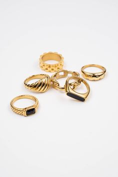 This new ring is a modern statement meant to be worn daily. Its classic combination of gold and black matches any outfit. Water Resistant 18K gold over stainless steel Hypoallergenic Made in United States Trendy Gold Stainless Steel Rings, Modern Gold-tone Tarnish Resistant Rings, Modern Metal Midi Rings Tarnish Resistant, Modern Gold-tone Tarnish-resistant Rings, Minimalist Black Tarnish Resistant Rings, Classic Gold Metal Midi Rings, Classic Gold Midi Rings, Classic Black Metal Rings, Minimalist Black Tarnish-resistant Rings