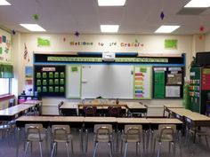 an empty classroom with desks and chairs