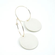 "Handmade Minimalist Porcelain and 14k Gold Plated Hoop Earrings. Each porcelain earring is handmade and glazed by hand. Due to the handmade nature of these earrings, they may vary slightly in shape, color and pattern. + Length: 2-1/4\" + Width: 1\" + All Earrings are Final Sale - I try to make sure that the colors represented are as close to true as possible, but please remember that colors may differ slightly from what your monitor displays. - Please note that porcelain jewelry is breakable. W Porcelain Earrings, Porcelain Jewelry, Modern Vase, Cloth Bag, White Glaze, Modern Earrings, Handmade Decorations, Cloth Bags, Handmade Natural