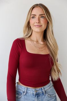 Introducing the Raven Burgundy Square Neck Crop Top—a versatile and chic addition to your wardrobe that effortlessly combines sophistication with a touch of contemporary flair! Elevate your casual ensembles with this essential piece, featuring a rich burgundy hue and a stylish square neckline. Crafted from a soft and stretchy fabric, this long sleeve crop top offers a comfortable and figure-flattering fit. The burgundy shade adds a sense of richness and warmth, making it a perfect choice for bot Rich Burgundy, Burgundy Top, The Raven, Fair Skin, Neck Crop Top, Long Sleeve Crop, Basic Tops, Burgundy Color, Stretchy Fabric