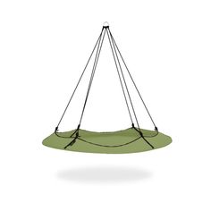 a green object hanging from a wire on a white background